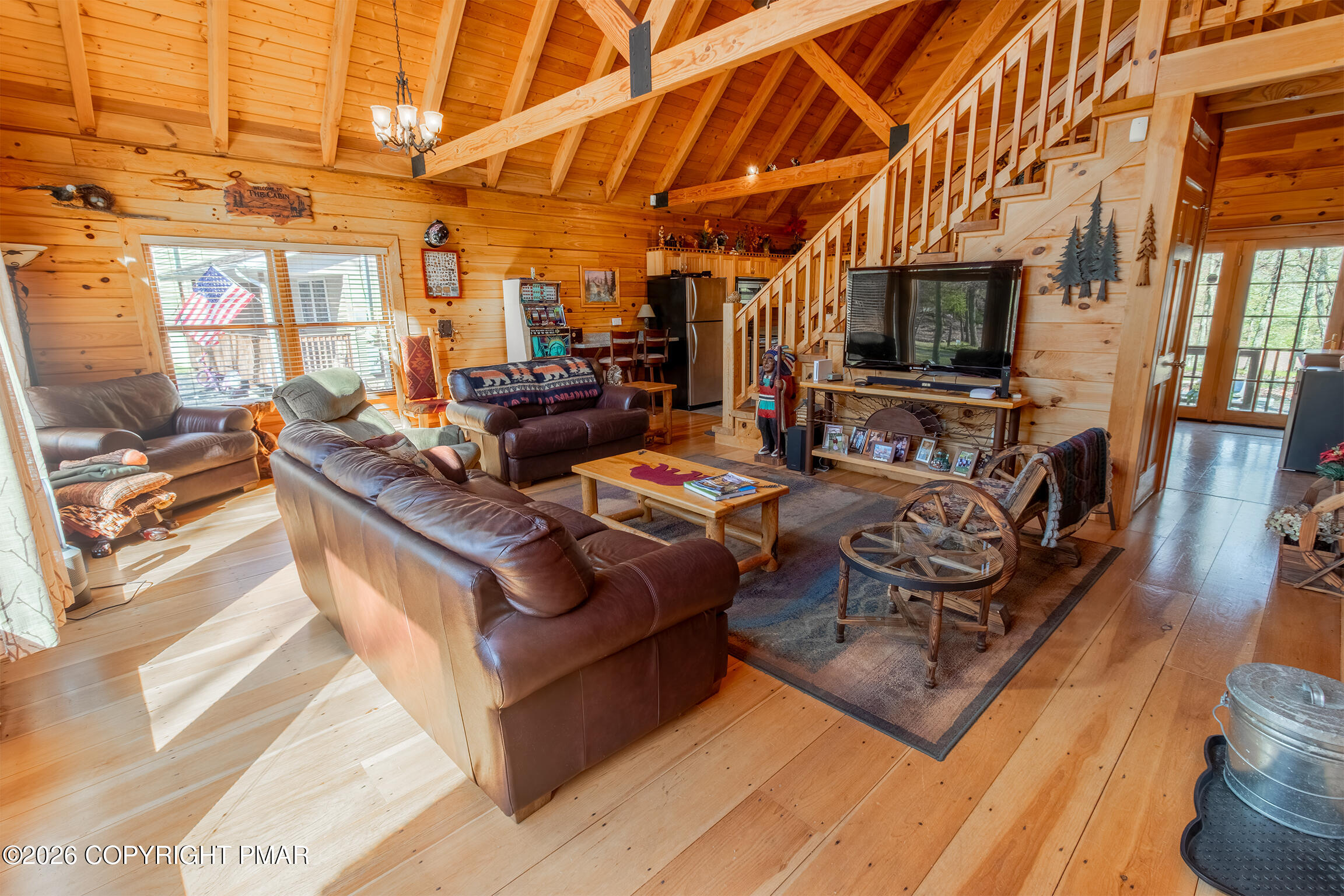 1160 Bluebird Lane Bushkill, PA 18324 - Photo 6 of 44 a living room with furniture a flat screen tv and a table