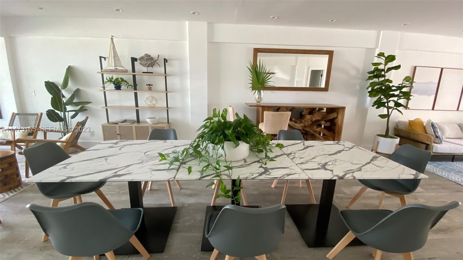 1801 South Surf Road, Unit 4C Hollywood, FL 33019 - Photo 11 of 14 a view of a dining room with furniture and wooden floor