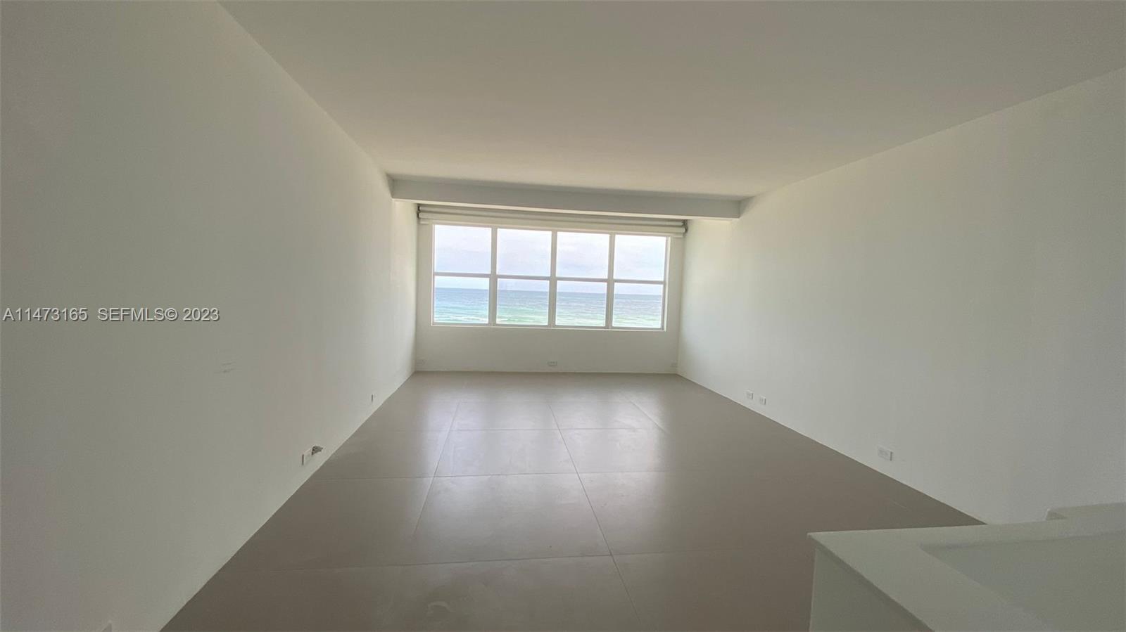 1801 South Surf Road, Unit 4C Hollywood, FL 33019 - Photo 8 of 14 a view of an empty room with a window