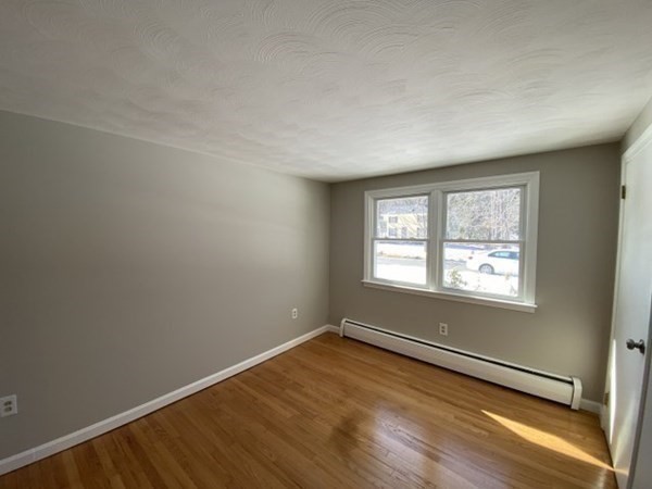 72 Bliss Street Northampton, MA 01062 - Photo 16 of 20 an empty room with wooden floor and windows