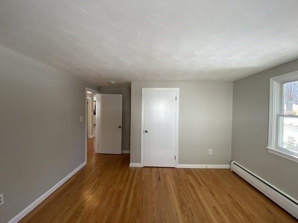 72 Bliss Street Northampton, MA 01062 - Photo 17 of 20 an empty room with wooden floor and windows