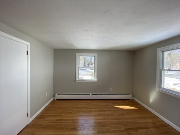 72 Bliss Street Northampton, MA 01062 - Photo 18 of 20 an empty room with wooden floor and windows