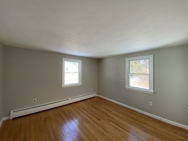 72 Bliss Street Northampton, MA 01062 - Photo 19 of 20 an empty room with wooden floor and windows