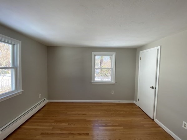 72 Bliss Street Northampton, MA 01062 - Photo 20 of 20 a view of an empty room with wooden floor and a window