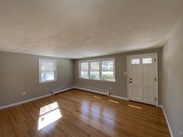 72 Bliss Street Northampton, MA 01062 - Photo 5 of 20 an empty room with wooden floor and windows