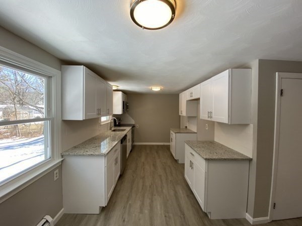 72 Bliss Street Northampton, MA 01062 - Photo 8 of 20 a kitchen with stainless steel appliances granite countertop a stove a sink and a refrigerator
