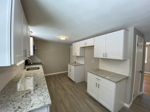 72 Bliss Street Northampton, MA 01062 - Photo 9 of 20 a kitchen with a stove top oven sink and cabinets