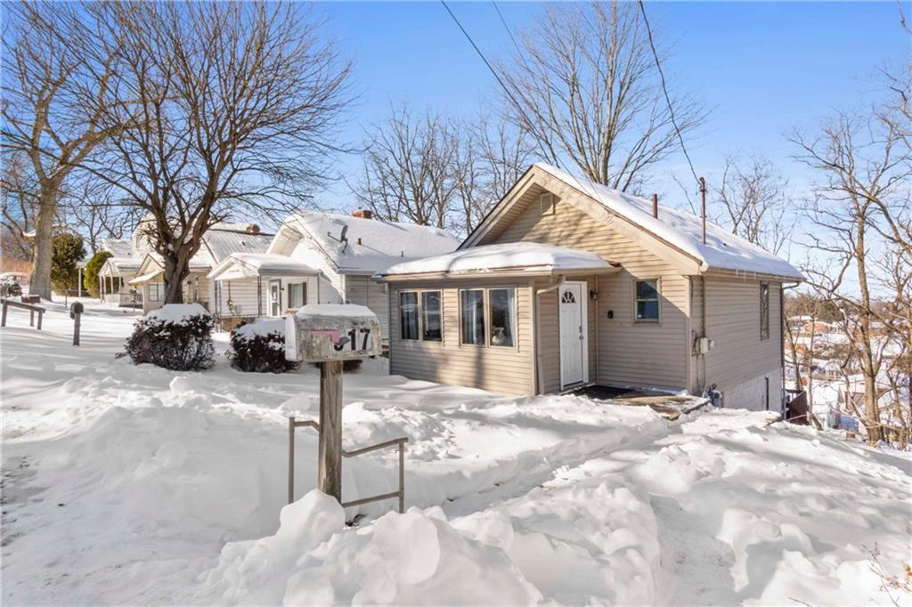 917 Session Street Pittsburgh, PA 15207 - Photo 2 of 15 a front view of a house with a yard covered in snow