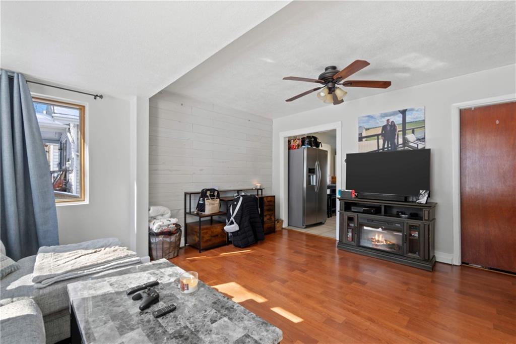 917 Session Street Pittsburgh, PA 15207 - Photo 4 of 15 a bedroom with furniture and a flat screen tv