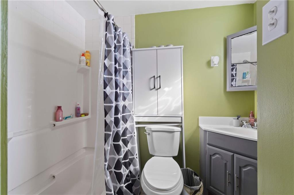 917 Session Street Pittsburgh, PA 15207 - Photo 9 of 15 a white toilet sitting next to a bathroom sink