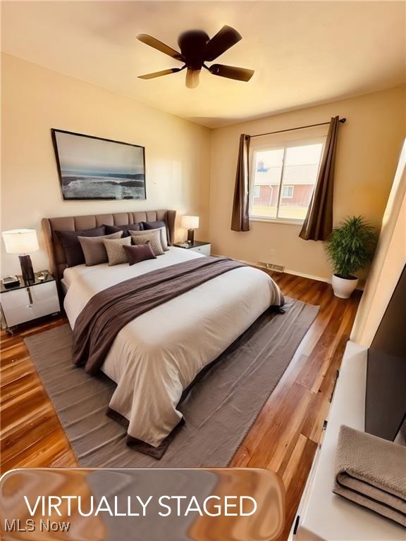 5651 Broadview Road, Unit B4 Cleveland, OH 44134 - Photo 13 of 19 Bedroom featuring light wood-style flooring and ceiling fan. VIRTUALLY STAGED