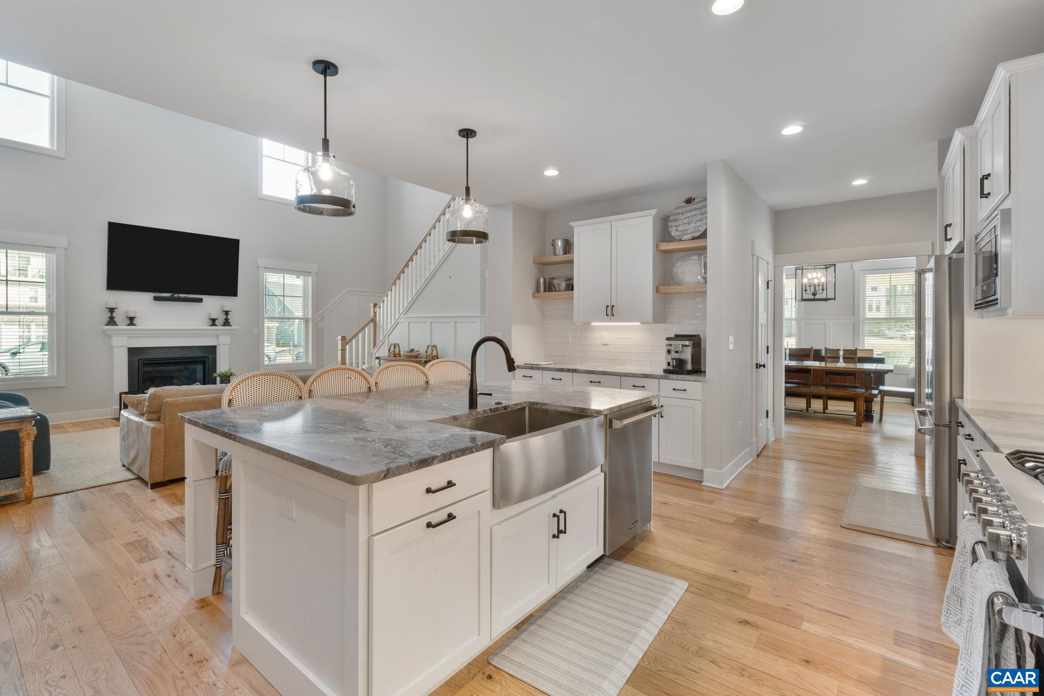 2206 Fowler Street Charlottesville, VA 22901 - Photo 12 of 59 a open kitchen with stainless steel appliances granite countertop a sink a stove and a refrigerator