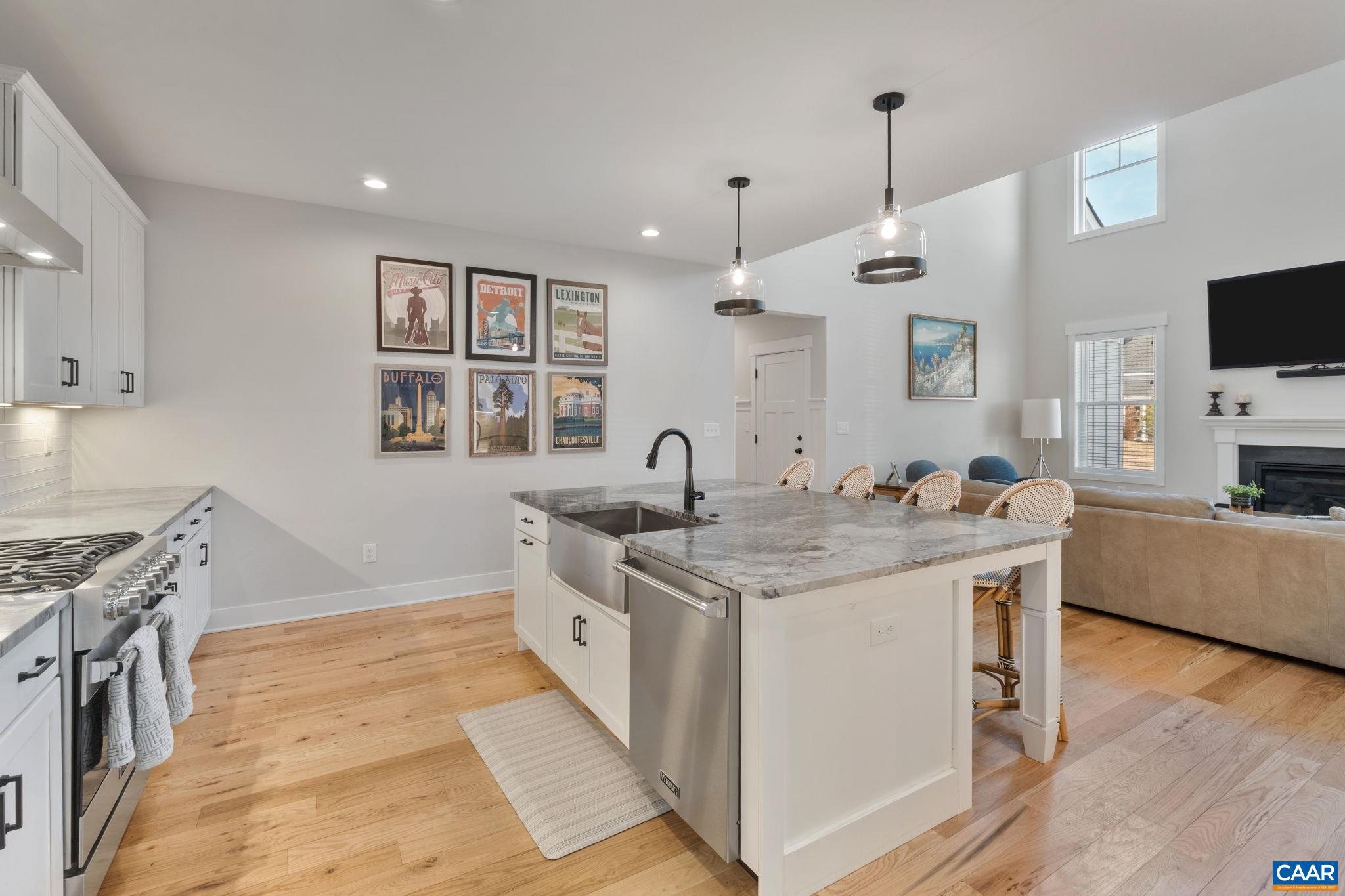 2206 Fowler Street Charlottesville, VA 22901 - Photo 13 of 59 a kitchen with granite countertop a sink and a stove top oven