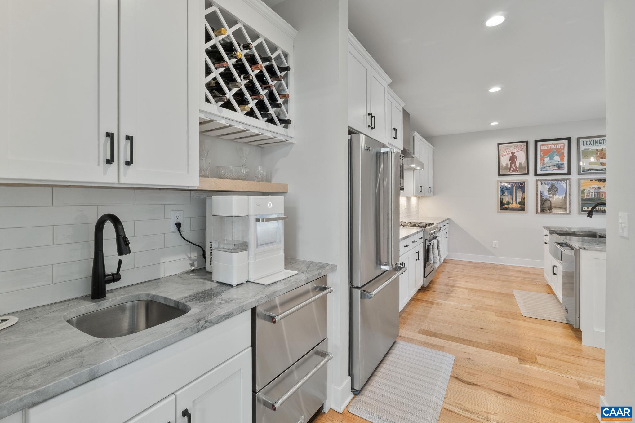 2206 Fowler Street Charlottesville, VA 22901 - Photo 15 of 59 a kitchen with stainless steel appliances a sink dishwasher a refrigerator and wooden cabinets