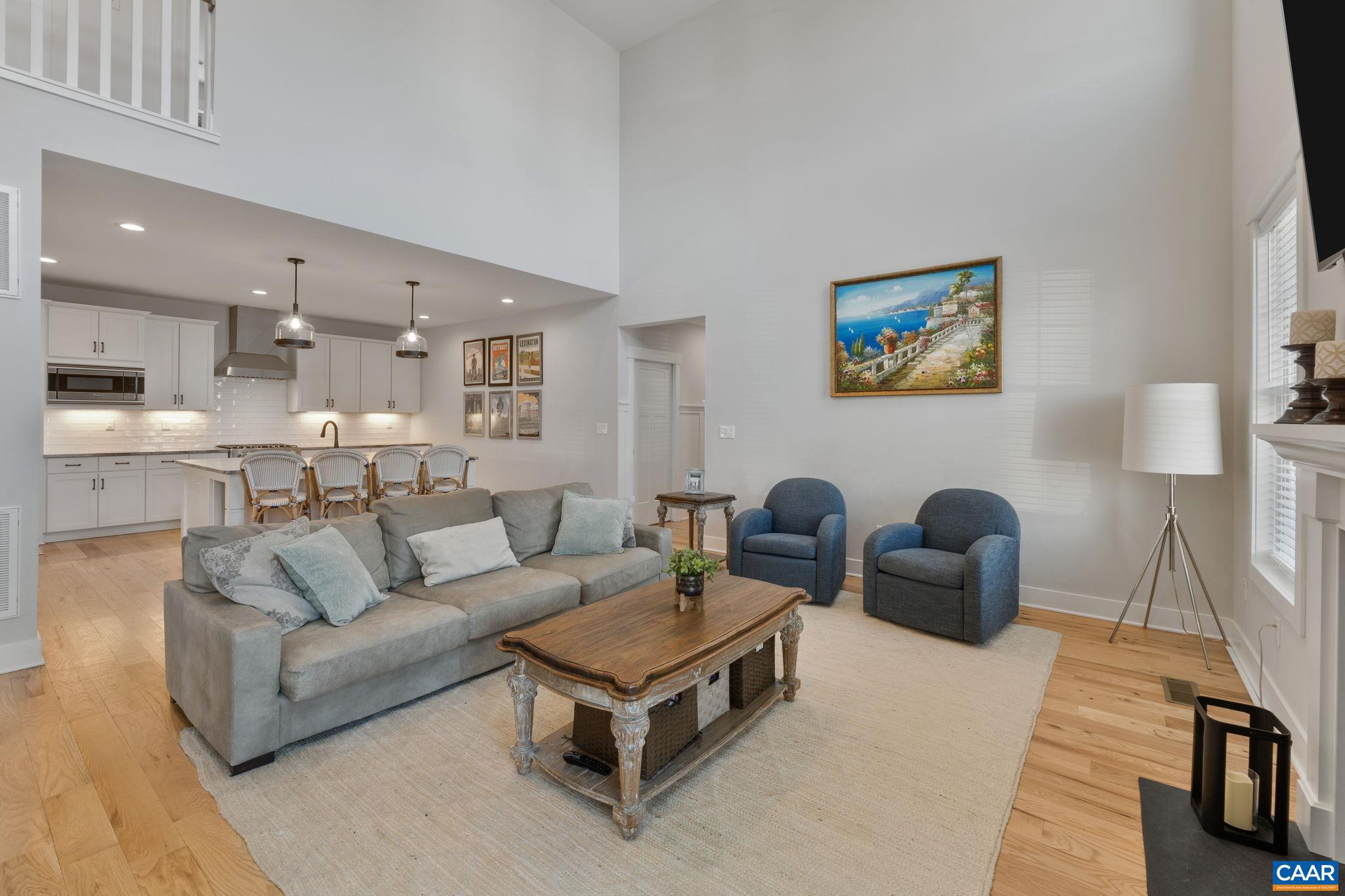 2206 Fowler Street Charlottesville, VA 22901 - Photo 17 of 59 a living room with furniture and a kitchen view