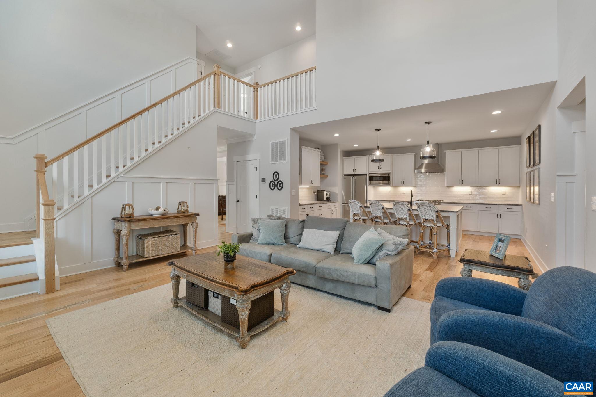 2206 Fowler Street Charlottesville, VA 22901 - Photo 19 of 59 a living room with furniture and a view of kitchen