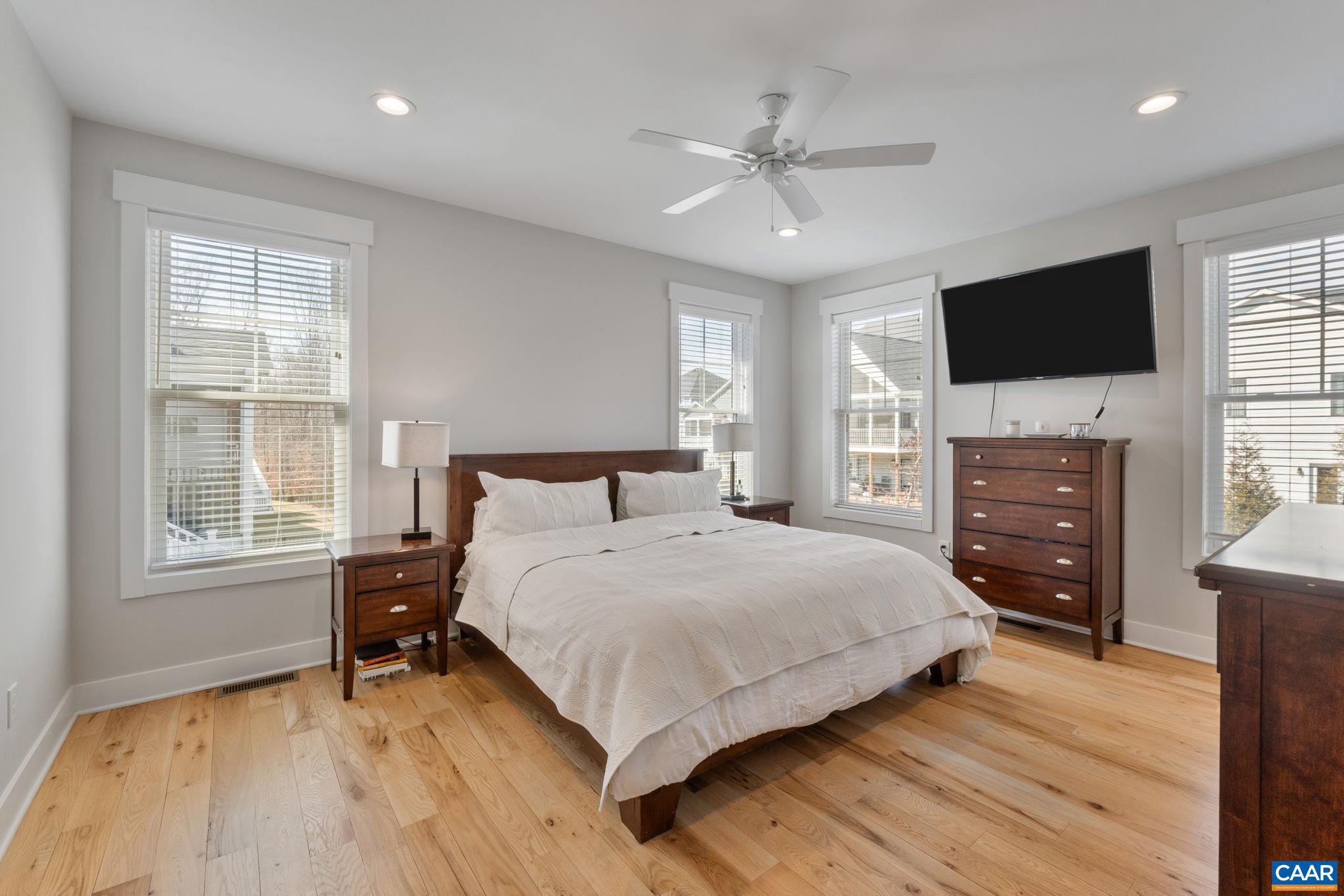 2206 Fowler Street Charlottesville, VA 22901 - Photo 21 of 59 a bedroom with a bed and a flat screen tv