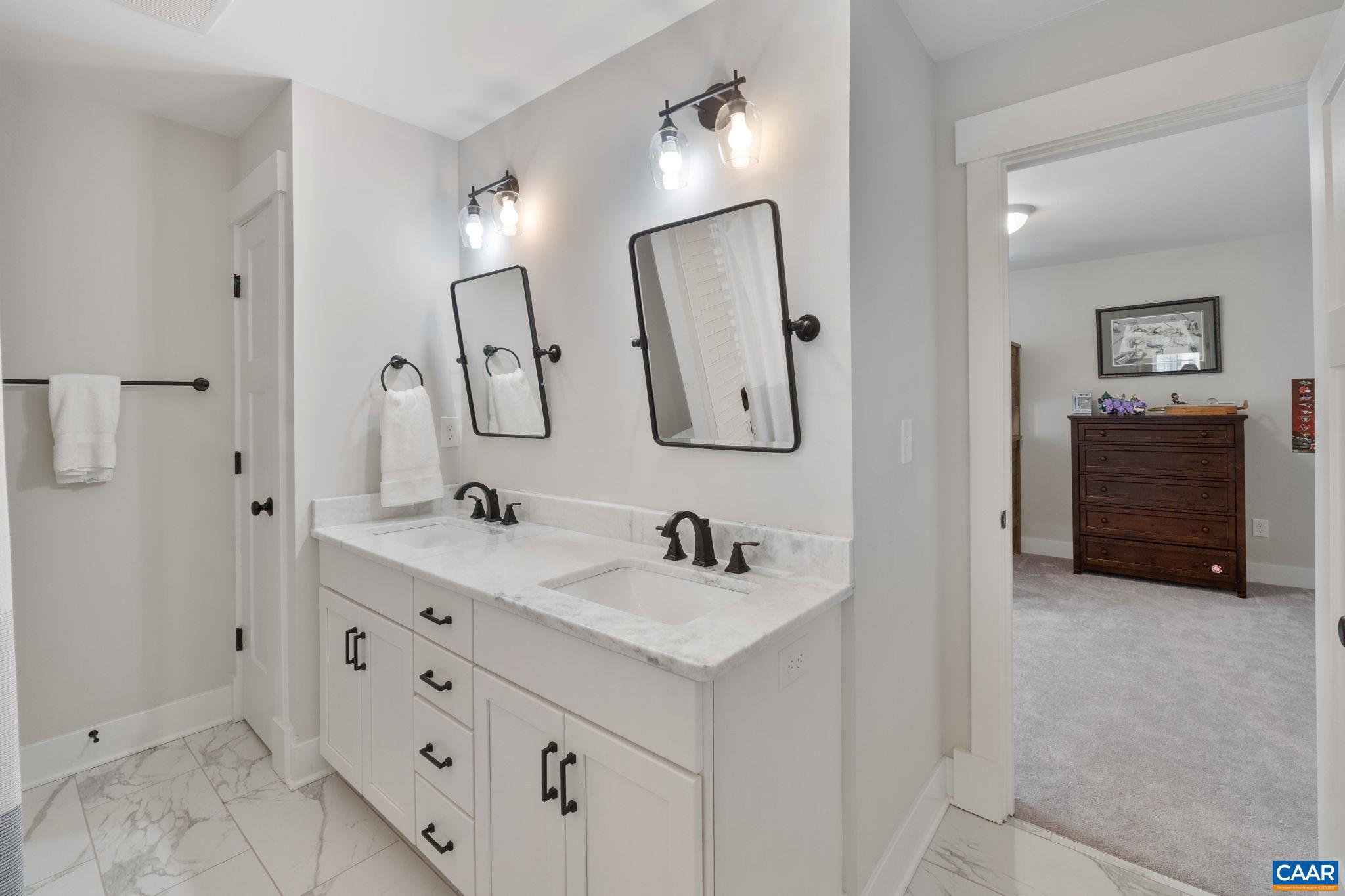 2206 Fowler Street Charlottesville, VA 22901 - Photo 32 of 59 a bathroom with a double vanity sink and a mirror