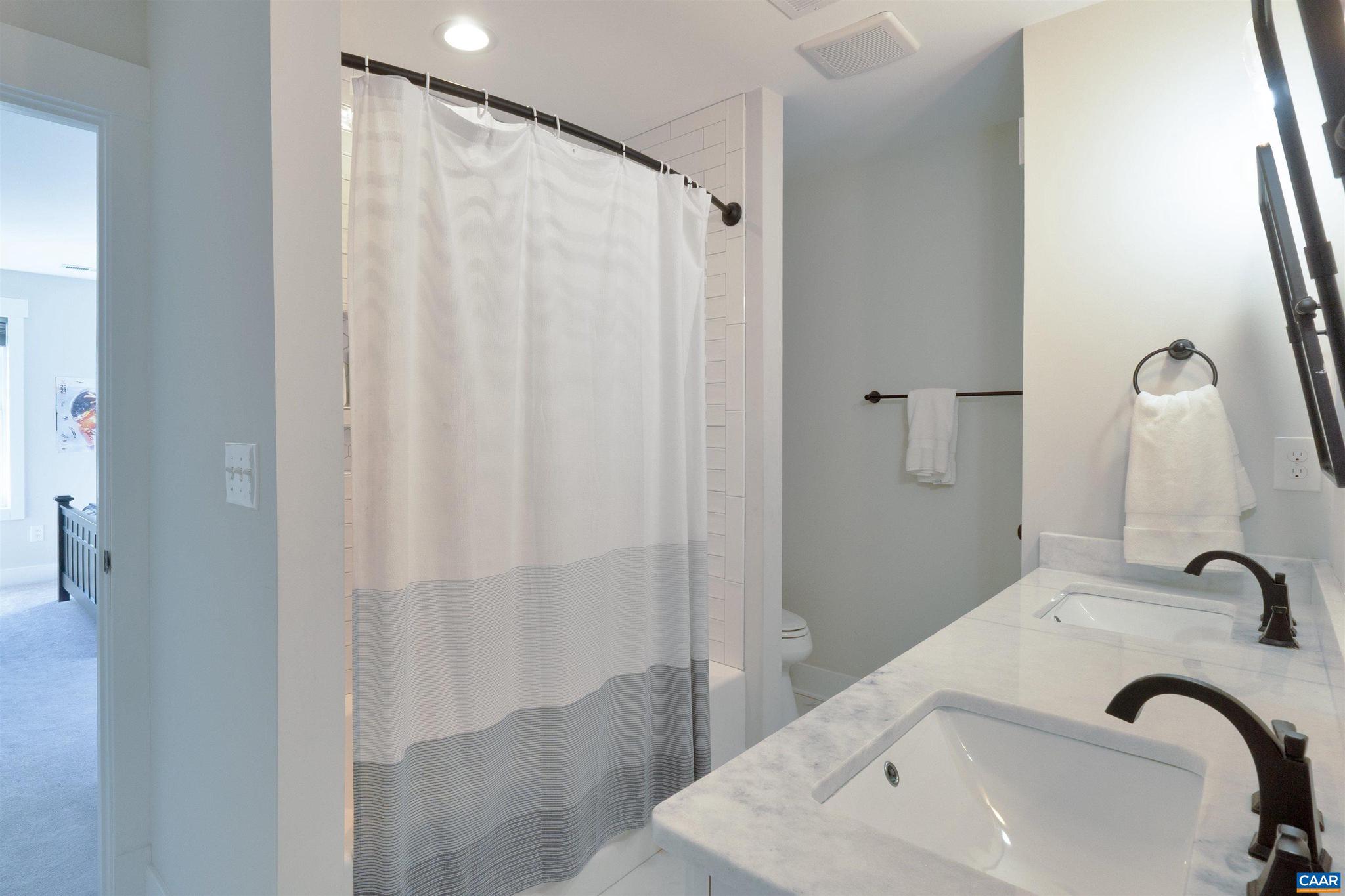 2206 Fowler Street Charlottesville, VA 22901 - Photo 33 of 59 a bathroom with a sink and a mirror