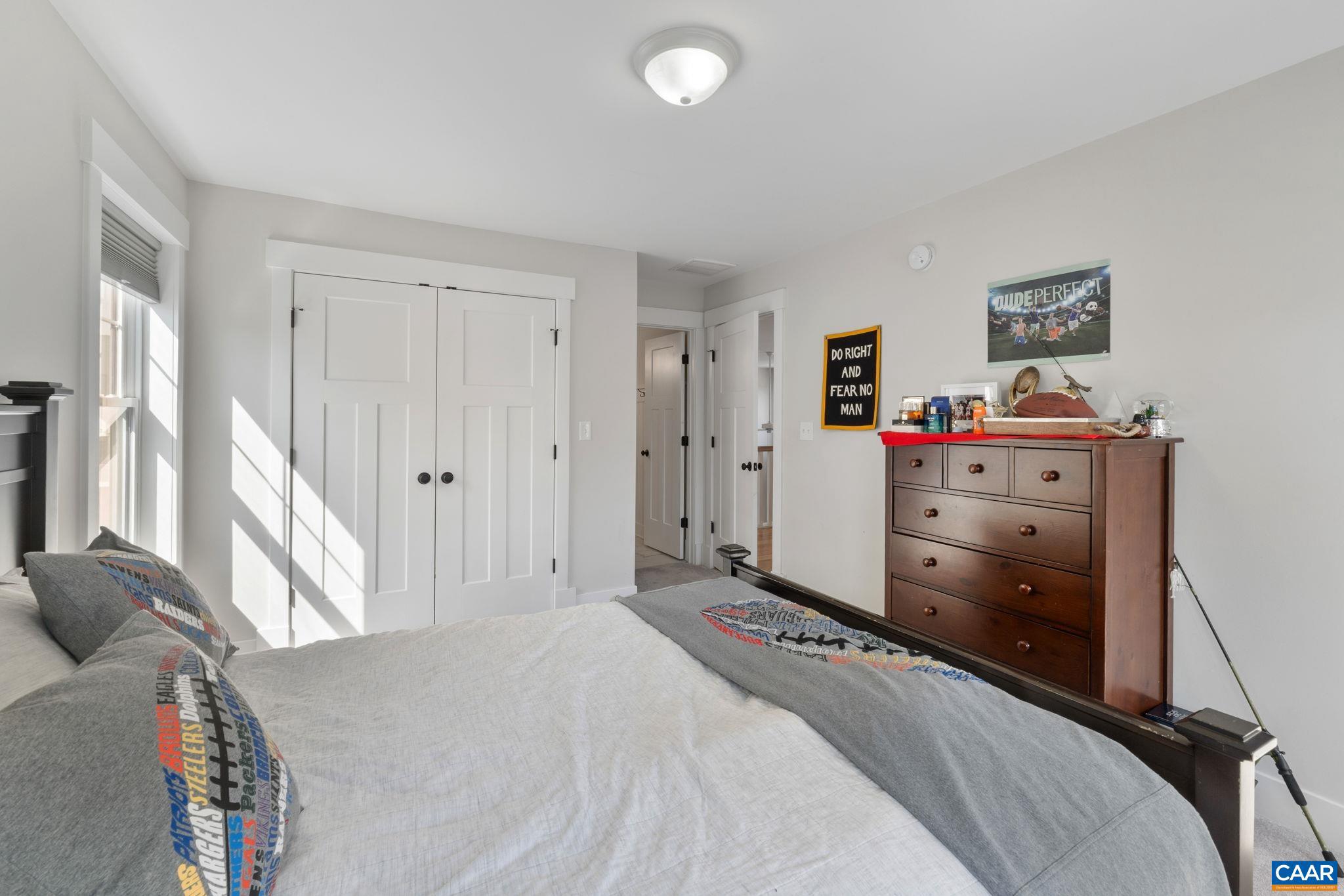 2206 Fowler Street Charlottesville, VA 22901 - Photo 35 of 59 a bedroom with a bed and a cabinets