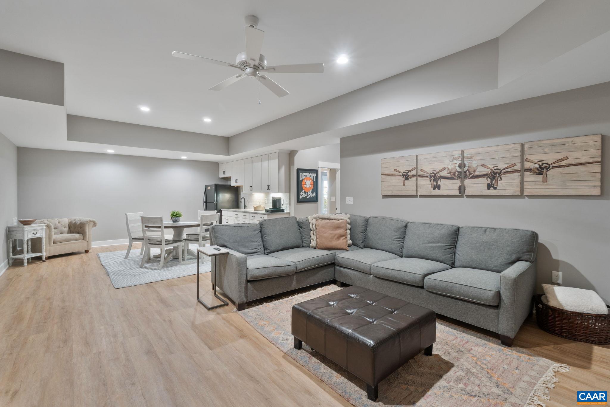 2206 Fowler Street Charlottesville, VA 22901 - Photo 36 of 59 a living room with furniture and view of kitchen