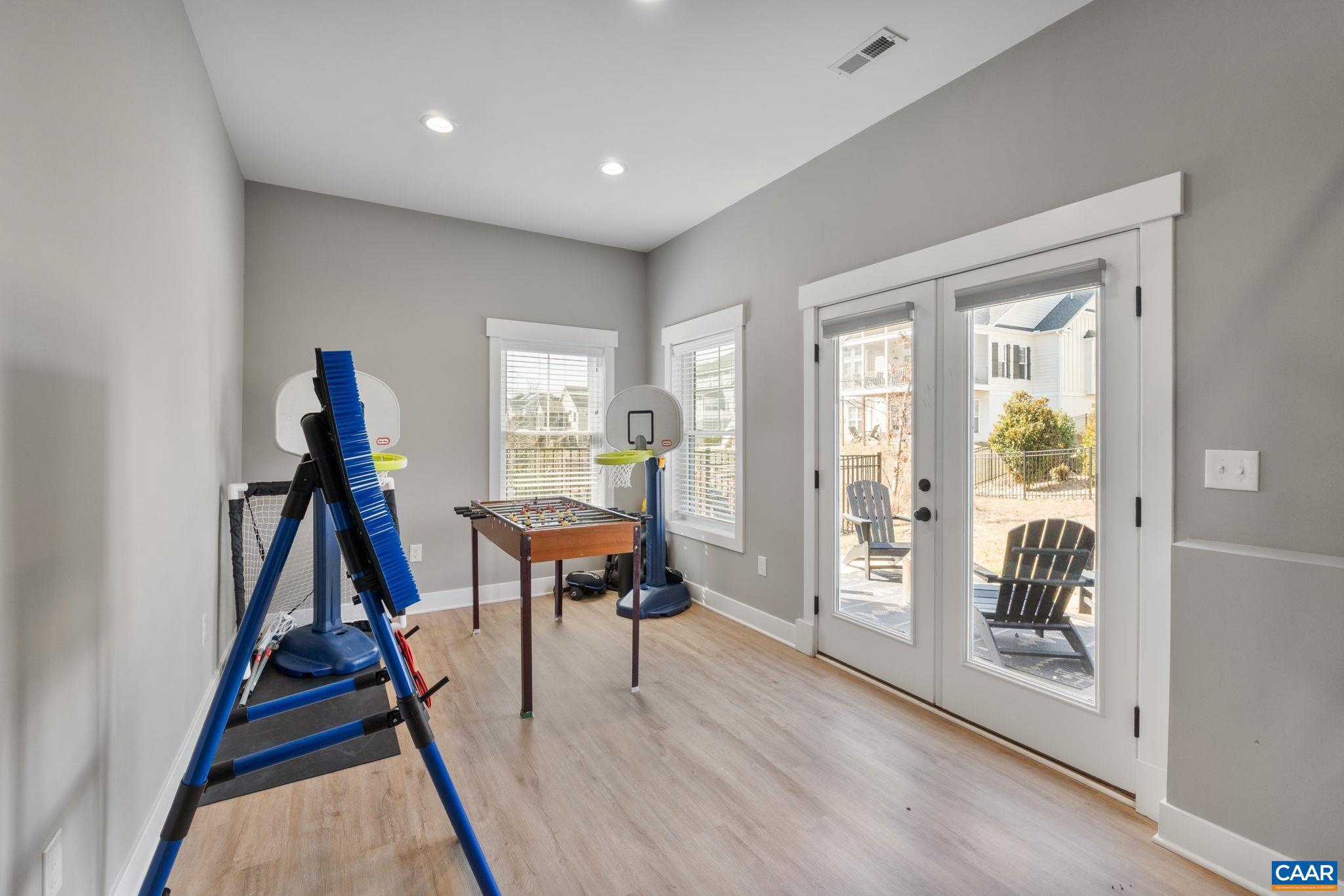 2206 Fowler Street Charlottesville, VA 22901 - Photo 43 of 59 a view of a room with furniture and wooden floor