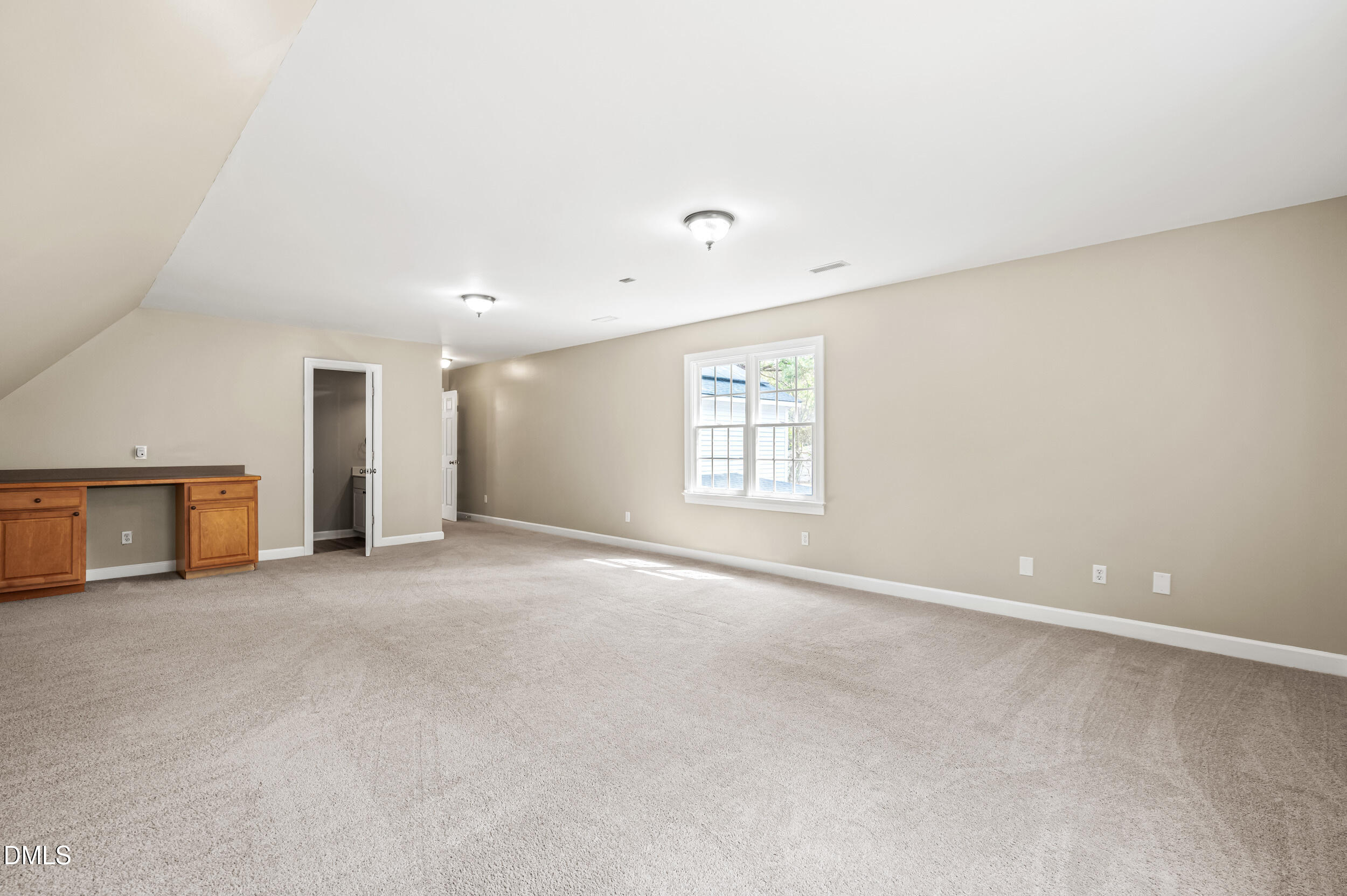 1957 Hilltop Road Raleigh, NC 27610 - Photo 30 of 46 an empty room with windows