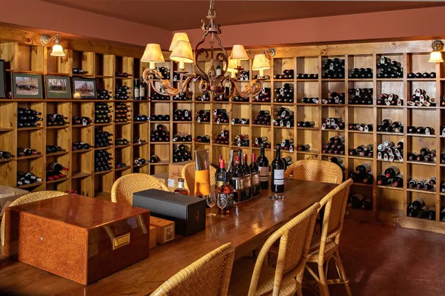 a kitchen with stainless steel appliances granite countertop a stove and a wooden floor
