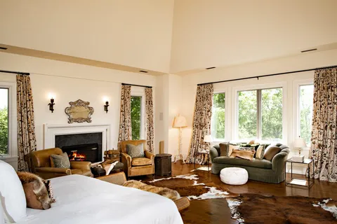 a bedroom with furniture and a flat screen tv