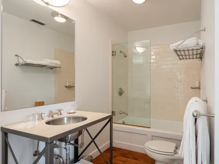 a bed room with a bed and a lamp