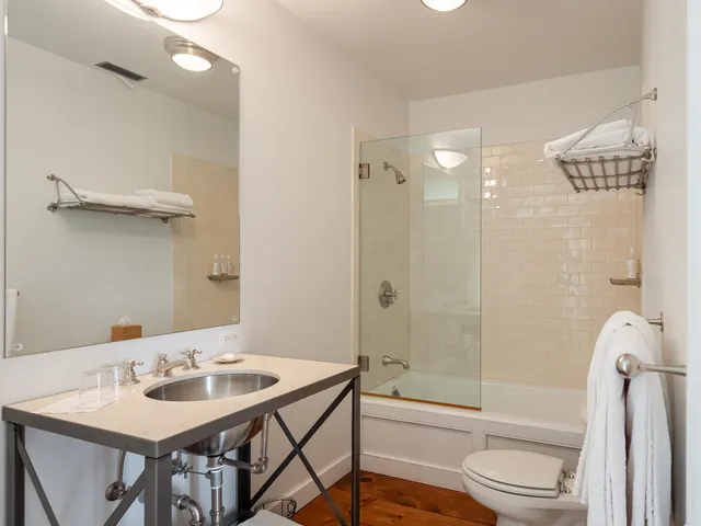 a bed room with a bed and a lamp