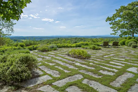 a view of an outdoor sitting area with furniture and garden