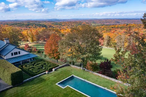 a view of a city with lawn chairs