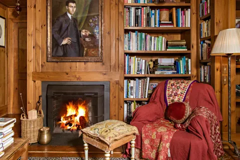 a reading room with furniture and a window