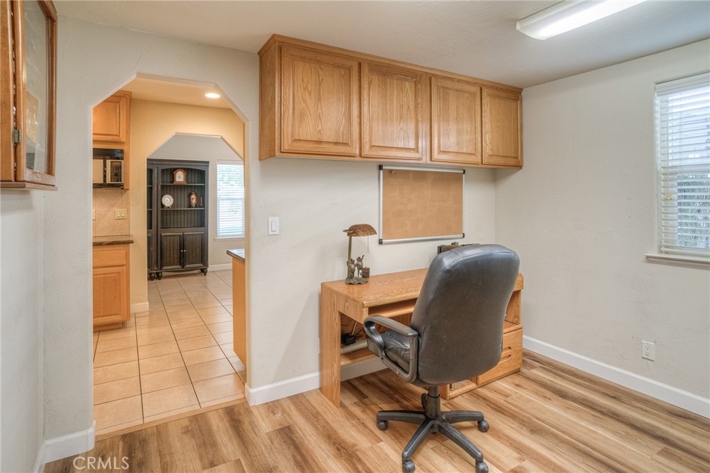 6060 Miners Ranch Road Oroville, CA 95966 - Photo 14 of 66 a view of a kitchen with furniture and wooden floor