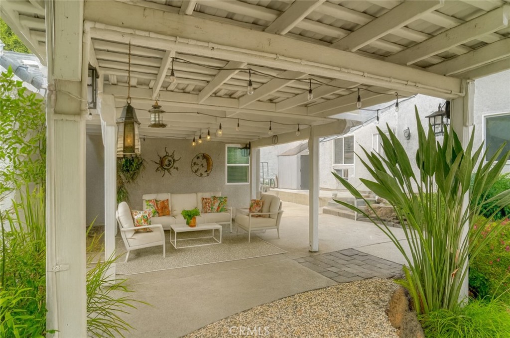6060 Miners Ranch Road Oroville, CA 95966 - Photo 23 of 66 a view of a patio with a table and chairs and potted plants