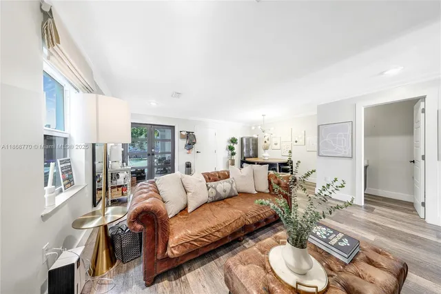 a living room with furniture and a table