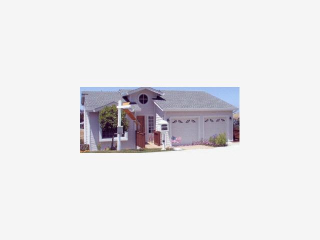 a front view of a house with a garage