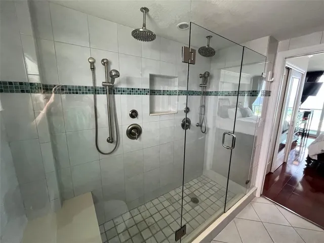 a bathroom with a shower and toilet