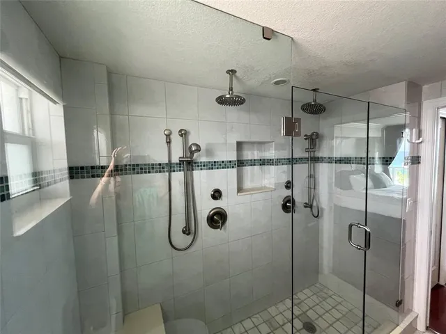 a bathroom with a sink a mirror a toilet and vanity