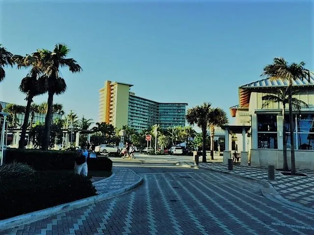 a view of a swimming pool and an outdoor seating