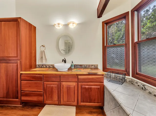 a bathroom with a bath tub and a shower
