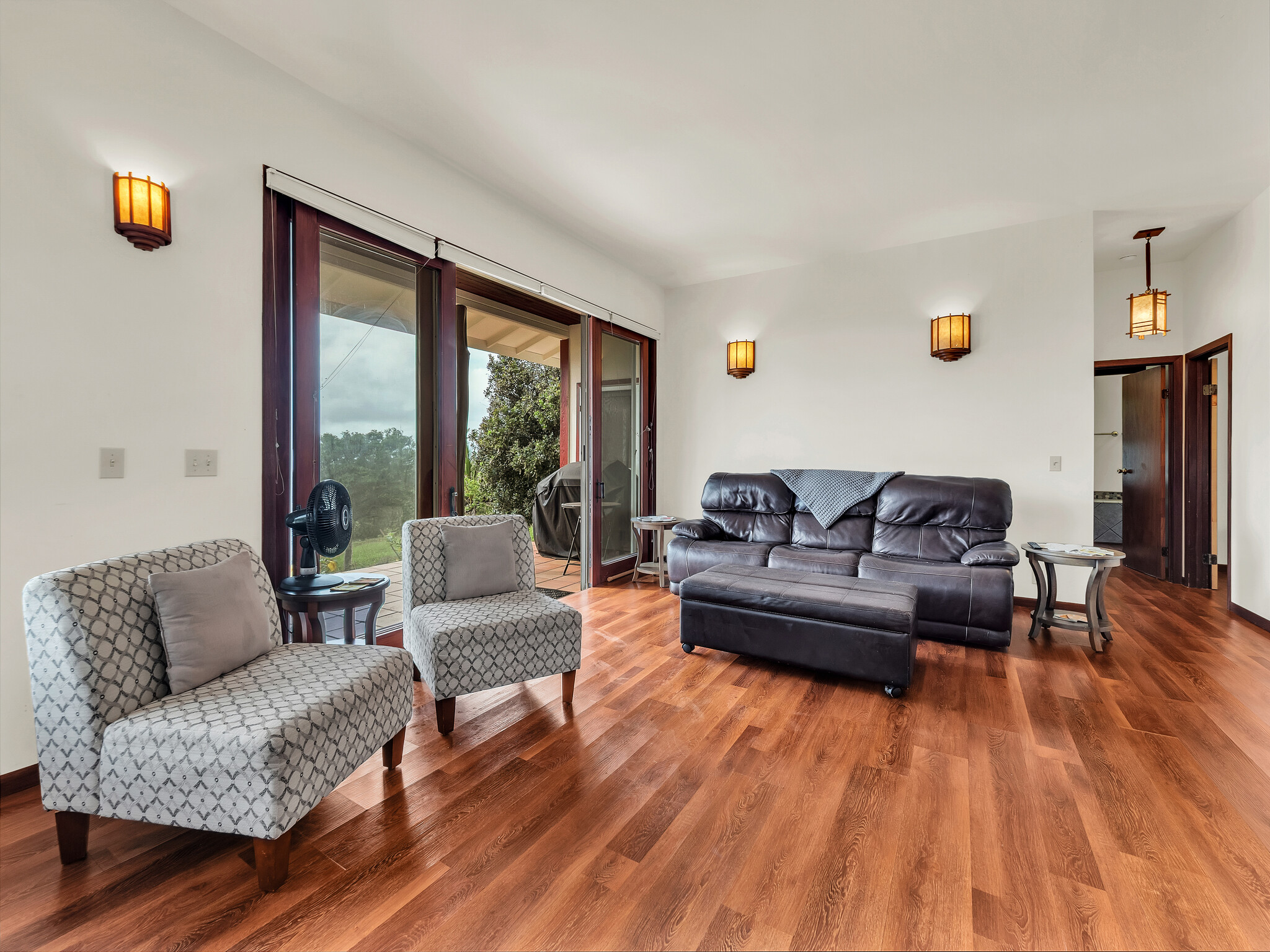 94-1769 Amepela Road Naalehu, HI 96772 - Photo 26 of 29 a living room with furniture and a large window