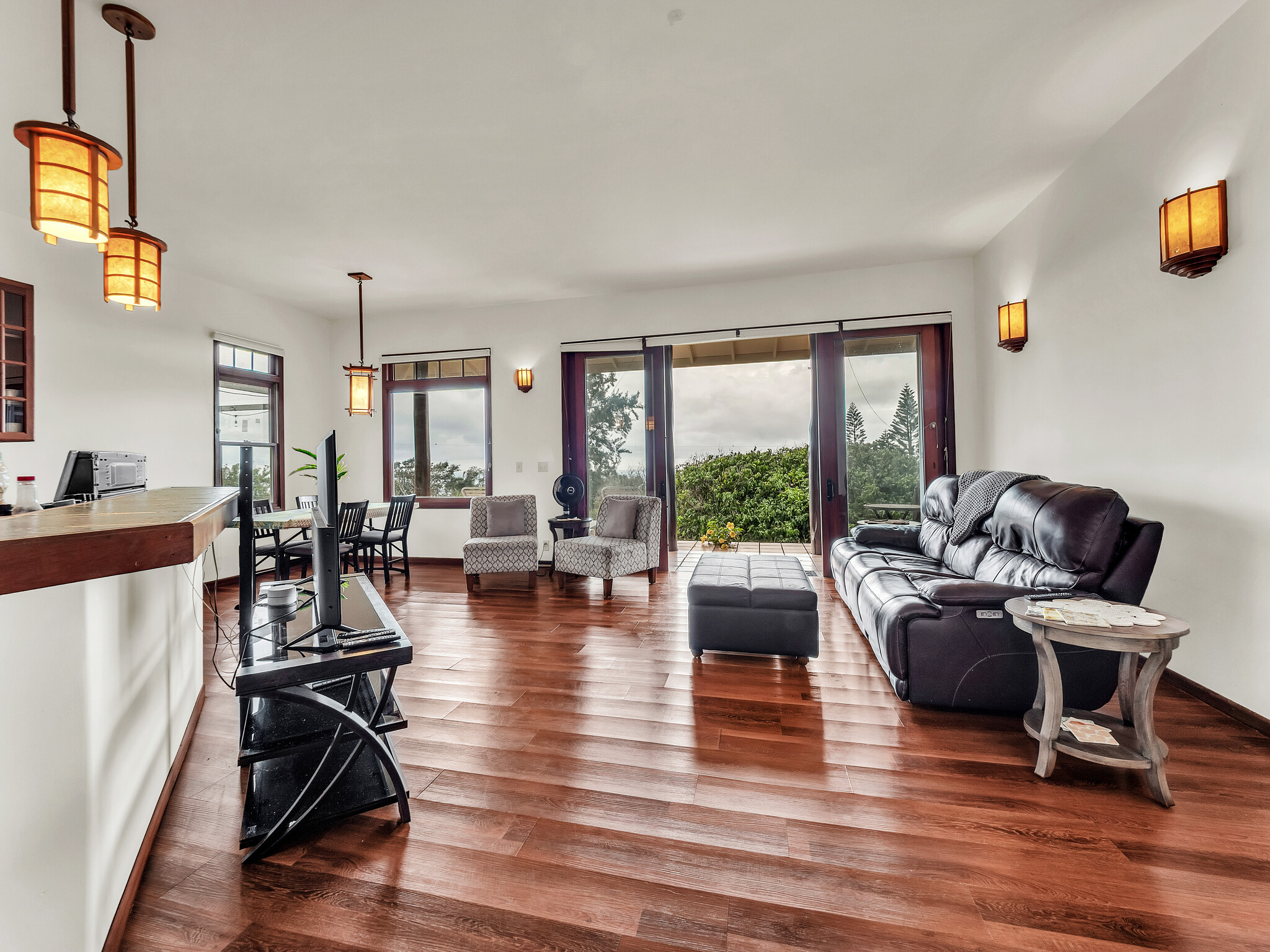 94-1769 Amepela Road Naalehu, HI 96772 - Photo 3 of 29 a living room with furniture and wooden floor