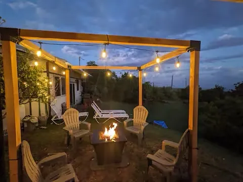 an aerial view of residential houses with outdoor space and river