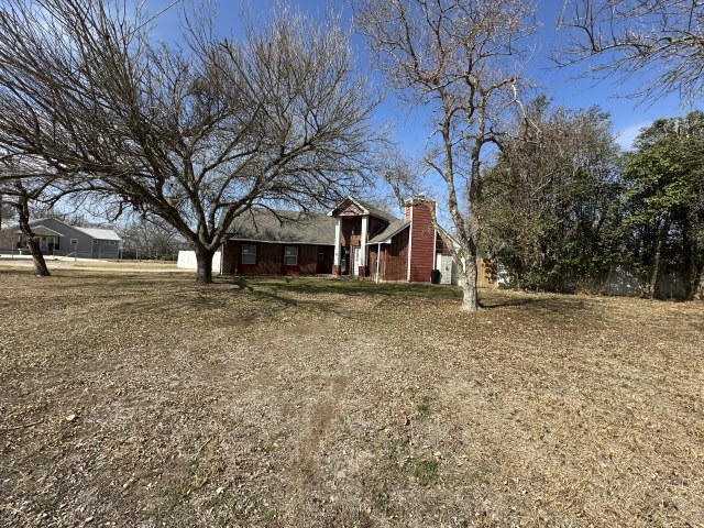 548 Spring River Drive Martindale, TX 78655 - Photo 1 of 17 View of home's exterior featuring a chimney