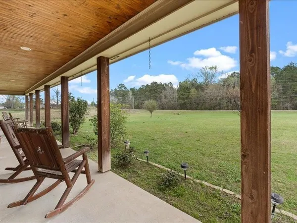 a view of a back yard from a balcony