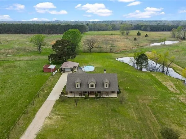 a view of a lake with a yard