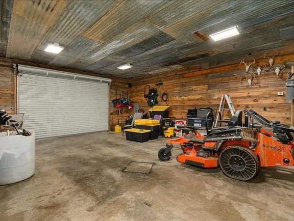 a view of parking garage with cars
