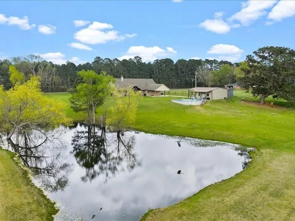 a view of a lake with a big yard